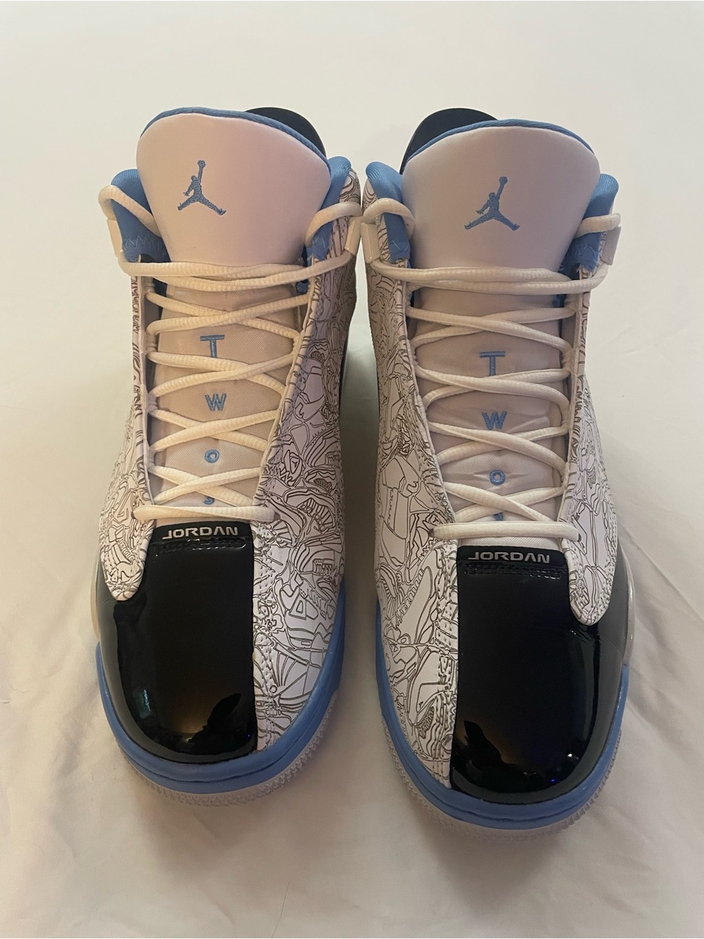 Jordan Men’s High-Top Sneakers in White, Black and Light Blue
